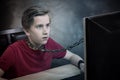 Teenager chained to his computer. Royalty Free Stock Photo