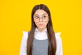 Teenager child girl with shocked facial expression. Surprised face expression,  on yellow background. Funny Royalty Free Stock Photo