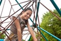 Teenager on a climbing frame in a park Royalty Free Stock Photo