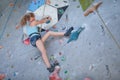 Teenager climbing a rock wall Royalty Free Stock Photo