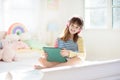 Teenager and computer. Teen school kid with tablet Royalty Free Stock Photo