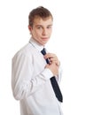 The teenager corrects a tie Royalty Free Stock Photo