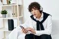 teenager on the couch with the phone internet Lifestyle technology Royalty Free Stock Photo