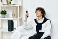 teenager on the couch with the phone internet Social networks Royalty Free Stock Photo