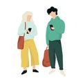 Teenager couple standing and chatting in the mobile phone