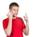 Teenager with a cream for a problem youthful skin Royalty Free Stock Photo