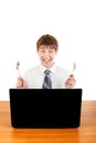 Teenager with Cutlery behind Laptop Royalty Free Stock Photo