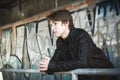 Teenager depressed inside a dirty tunnel Royalty Free Stock Photo