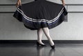 Teenager doing character ballet dance with skirt held in preparation