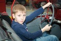 The teenager driving the car in the Museum of technology