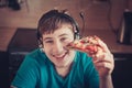 Teenager eating pizza sitting at a laptop. Royalty Free Stock Photo