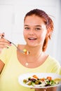 teenager eating salad Royalty Free Stock Photo