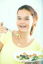 Teenager eating salad Royalty Free Stock Photo