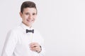 Teenager in elegant white shirt with paper dicky bow