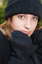 EMILY SAARI wearing black winter mittens, scarf and hat