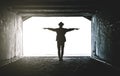 Teenager at the end of a dark tunnel Royalty Free Stock Photo