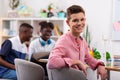 Teenager feeling motivated after studying with ark-skinned friends