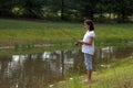 Teenager fishing on river