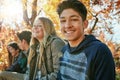 Teenager, friends and portrait in outdoor, boy and diversity on holiday, nature and relax by trees. Youth culture, happy Royalty Free Stock Photo