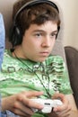 Teenager with game pad