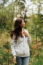 teenager gen z girl walking in the forest. close to nature concept Royalty Free Stock Photo