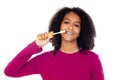 Teenager girl with afro hair wearing pink sweater