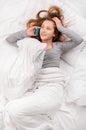 Teenager girl bed cell phone Royalty Free Stock Photo