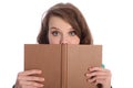 Teenager girl with blue eyes reading a book