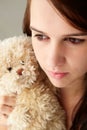 Teenager girl close up with teddy bear Royalty Free Stock Photo