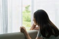 Teenager girl with depression sitting alone on sofa at home. Sad, unhappy, disappointed concept. Close up Royalty Free Stock Photo