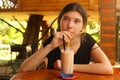 Teenager girl drink sappodila milk shake