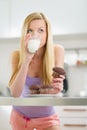 Teenager girl eating chocolate muffin with milk Royalty Free Stock Photo