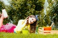 Teenager girl gardening. Girl with pot in garden. Little Farmer girl examining Common fig crop in plantation or field Royalty Free Stock Photo