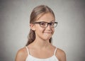 Teenager girl with glasses looking suspicious, skeptical