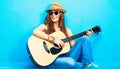 Teenager girl guitar play sitting on a floor Royalty Free Stock Photo