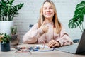 A teenager girl with her thumb up studying robotics at home, stem and arduino coding classes for children