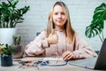 A teenager girl with her thumb up studying robotics at home, stem and arduino coding classes for children