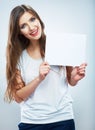 Teenager girl hold white blank paper. Young smiling woman show Royalty Free Stock Photo