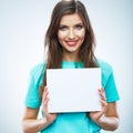 Teenager girl hold white blank paper. Young smiling woman show Royalty Free Stock Photo