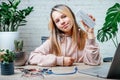 A teenager girl holding a sensor chip studying robotics at home, stem and arduino coding classes for children