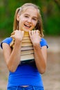 Teenager girl holding stack Royalty Free Stock Photo