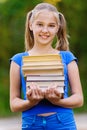 Teenager girl holding stack Royalty Free Stock Photo
