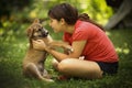 Teenager girl hug puppy shepherd dog close up photo Royalty Free Stock Photo