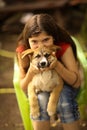 Teenager girl hug puppy shepherd dog close up photo Royalty Free Stock Photo