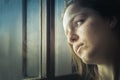 Portrait of a teenager girl thinking, sad, looking away next to Royalty Free Stock Photo