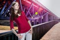 Teenager girl looking up, modern bridge background Royalty Free Stock Photo