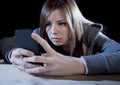 Teenager girl looking worried and desperate to mobile phone as internet stalked victim abused cyberbullying stress Royalty Free Stock Photo