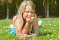 Teenager girl lying on grass Royalty Free Stock Photo