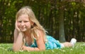 Teenager girl lying on grass Royalty Free Stock Photo