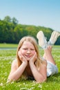 Teenager girl lying on the grass Royalty Free Stock Photo